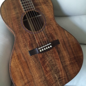 Bookmatched Koa body. Top and back cut from same piece